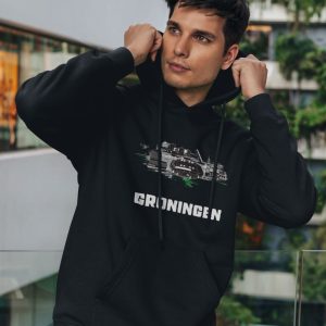 groningen hoodie, zwart, graffiti achtergrond zwart wit grijs, groen witte vlekken, zwart-witte skyline, stadion in het midden, stadsnaam, supportersdesign, urban streetwear, supporterskantine