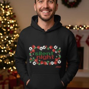 Zwarte unisex hoodie met de tekst "Silent Night... not tonight" en een grafische rand van kerstballen en voetballen.