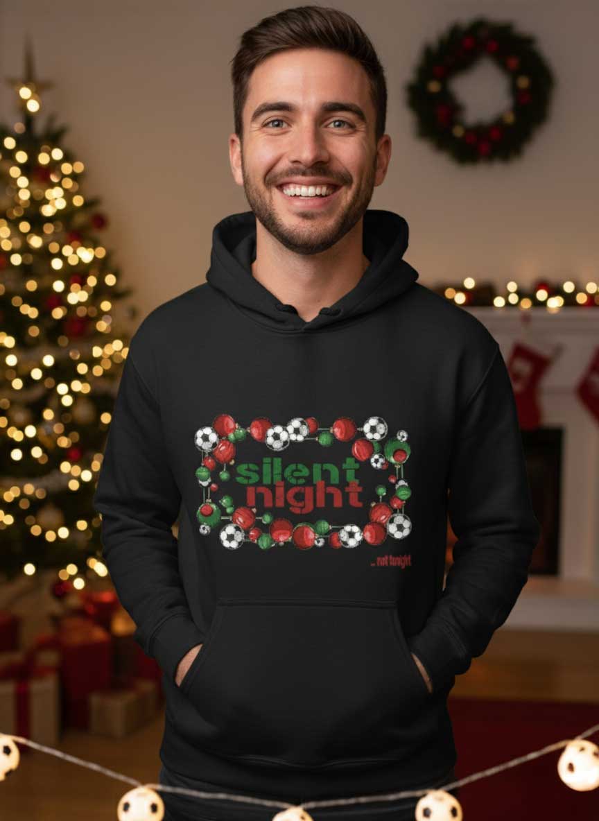 Zwarte unisex hoodie met de tekst "Silent Night... not tonight" en een grafische rand van kerstballen en voetballen.